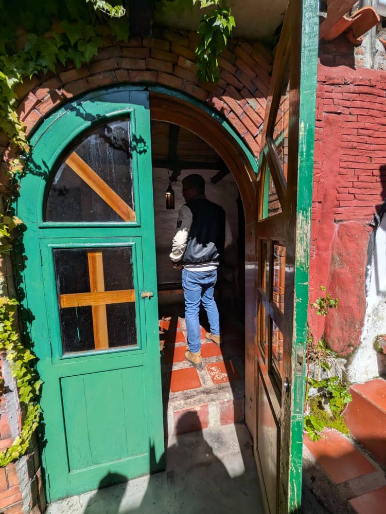 Green door and paved courtyard