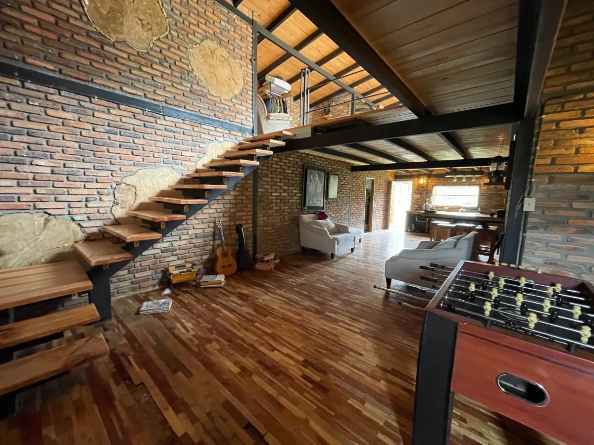 Double-height living room with stairs to the loft