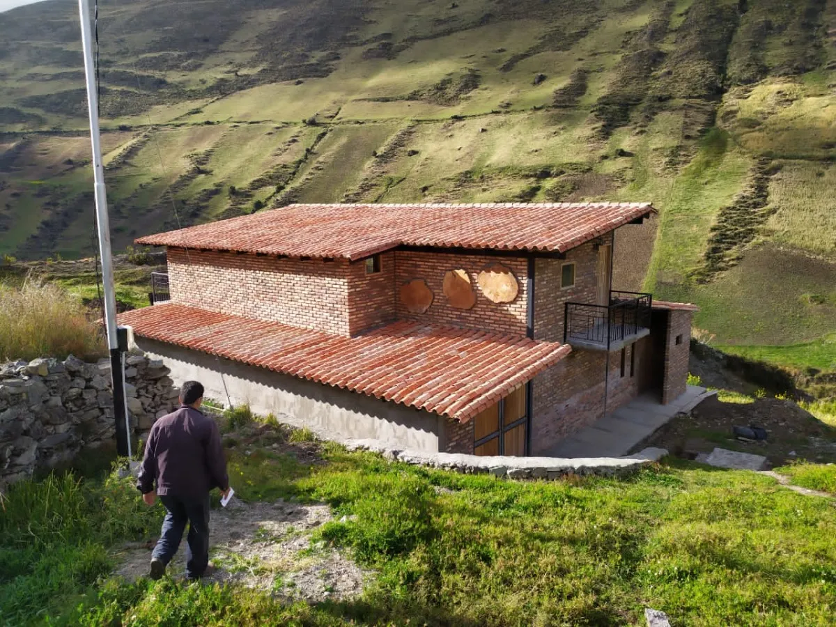 Terra's stone warehouse, with the mountain behind